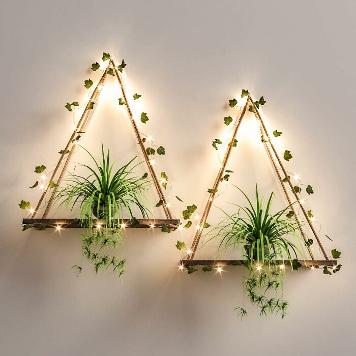 Triangle-shaped wall shelves with plants and lights, showcasing Amazon furniture with excellent reviews.