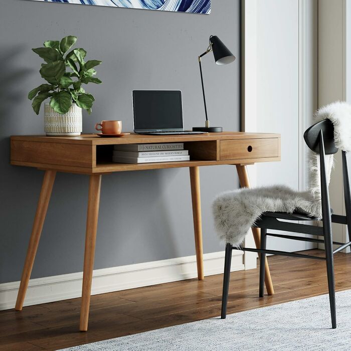 Modern wooden desk with decor, lamp, and chair; high-rated Amazon furniture.