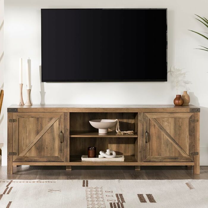 Rustic wooden TV stand from Amazon with excellent reviews, featuring ample storage and farmhouse style decor.