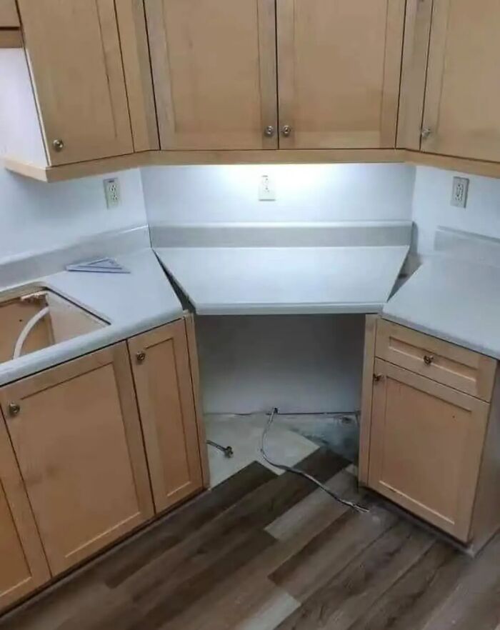 Kitchen with misaligned cabinetry, illustrating a funny cheap construction fail.