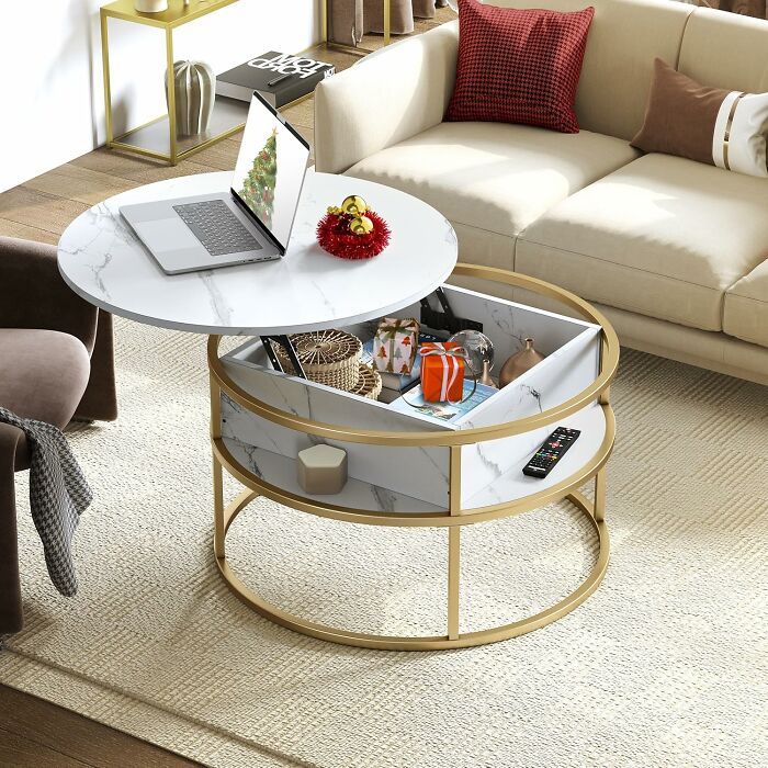 Modern coffee table with storage, laptop, and decor, showcasing excellent reviewed Amazon furniture in a cozy living room setting.