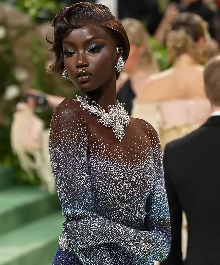 Anok Yai, elegant model in a sparkling gown at Met Gala event, showcasing style and grace in the fashion industry.