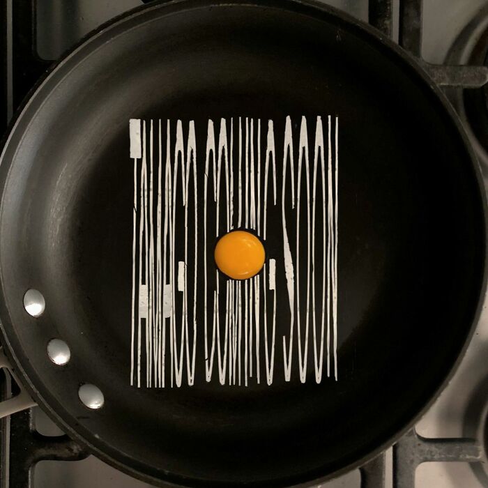 Creative way to fry eggs with a yolk on a pan displaying "COMING SOON."