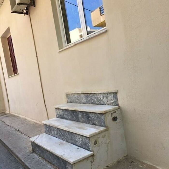 Construction blunder with stairs leading directly into a wall, showcasing a hilarious mistake.