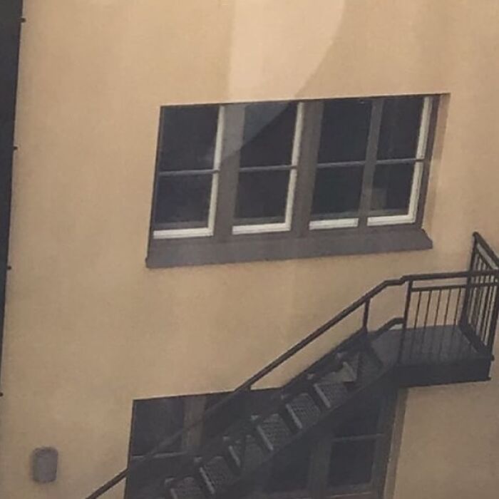 Staircase ending at a window, showcasing a hilariously wrong construction job.