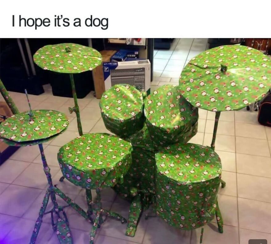 Christmas meme showing a drum set wrapped in festive paper with text: "I hope it’s a dog."