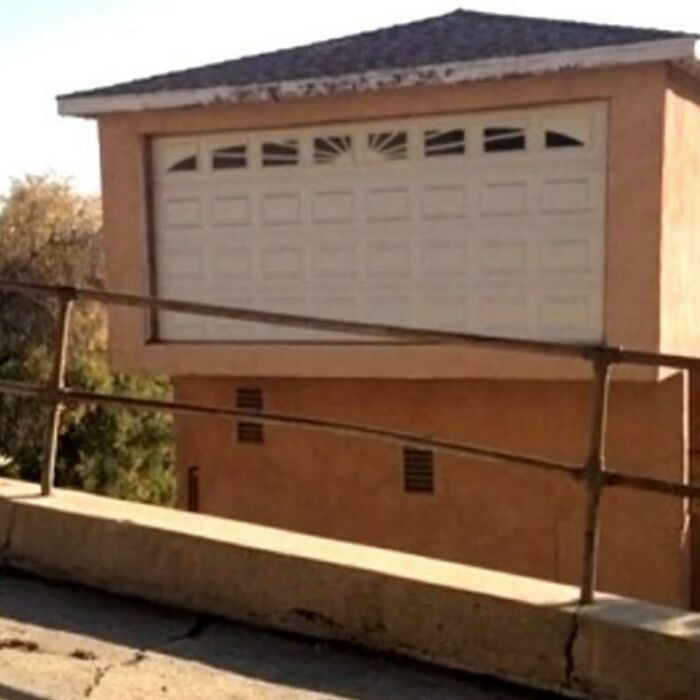 Garage door built on second floor, illustrating construction error.