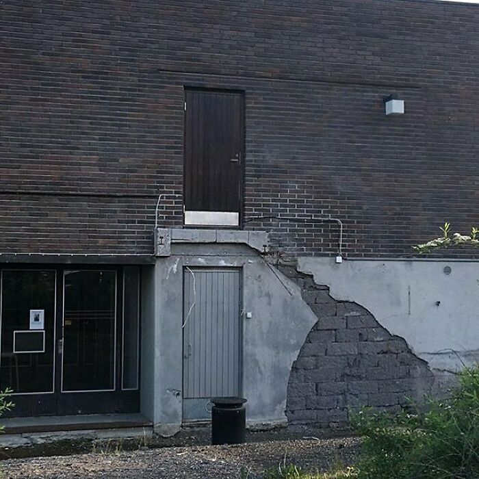 Misaligned building door placed above the ground, exemplifying construction mishaps.