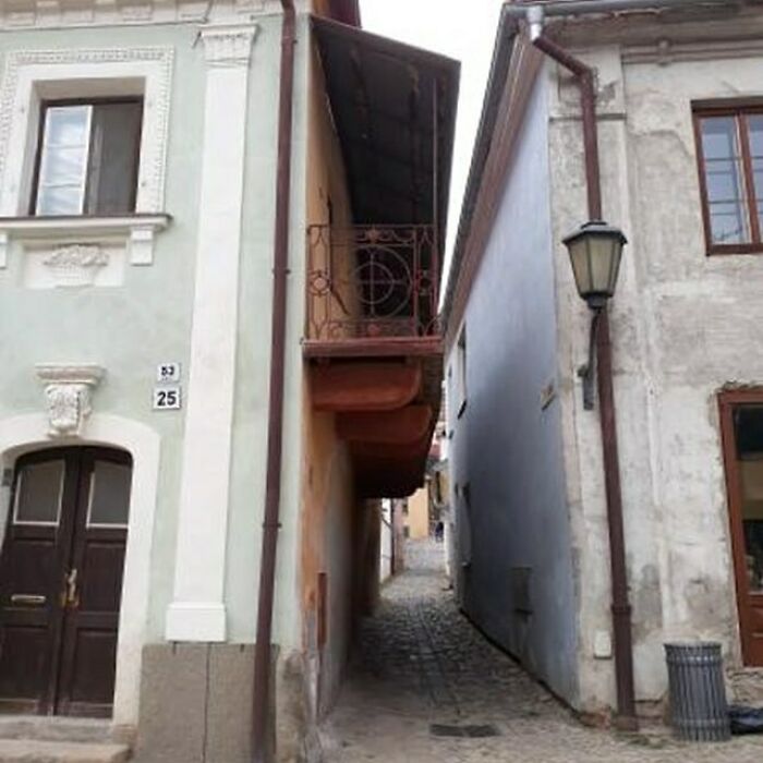 Construction fail with balcony built into a narrow alley, showcasing poor planning and execution.