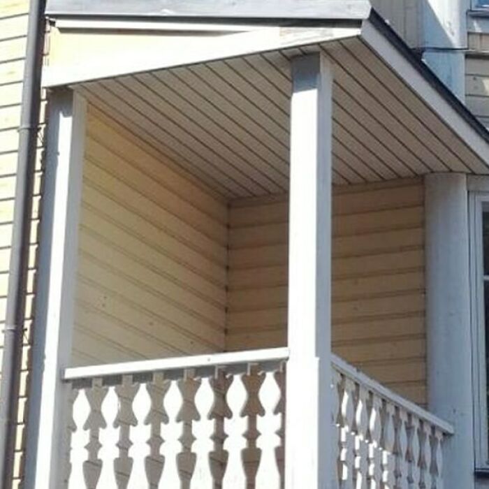 Humorous construction mistake: balcony without a floor, showcasing a construction fail.