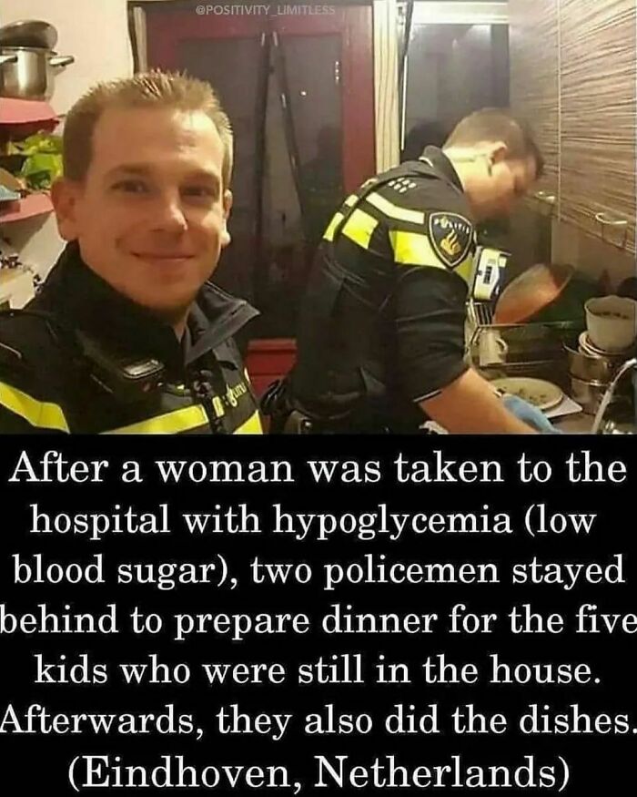 Two policemen in Eindhoven showing wholesome kindness by cooking and doing dishes for children after an emergency.