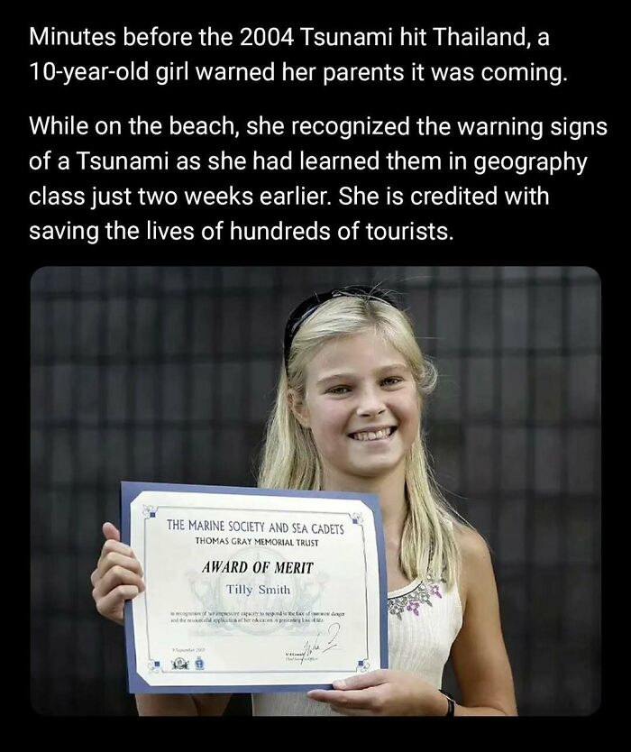 Girl holding an Award of Merit certificate, honored for her quick action during the 2004 tsunami. Wholesome kindness moment.