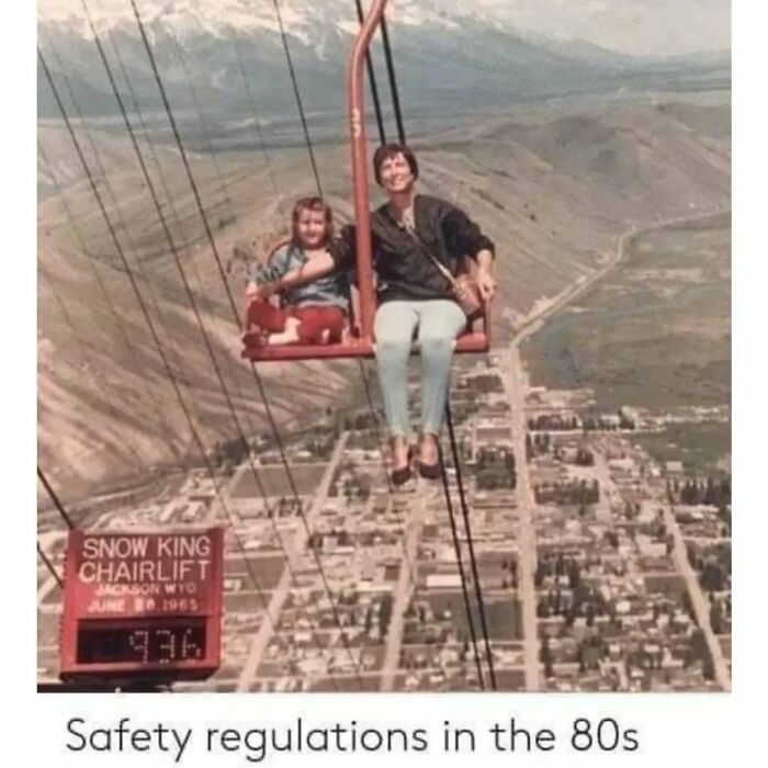 "Vintage chairlift ride above city, showcasing worst funny fail from the 80s."