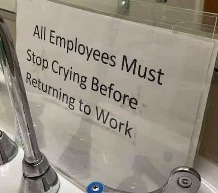 Sign reading "All Employees Must Stop Crying Before Returning to Work" - a humorous work meme.