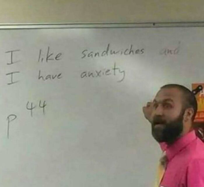 Teacher pointing at whiteboard with funny, relatable mental health meme about anxiety and sandwiches.