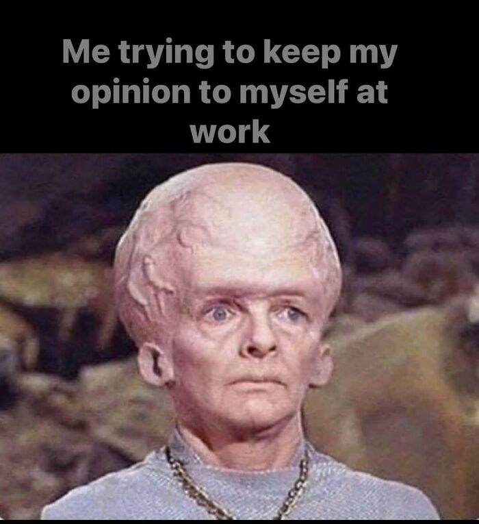 A humorous work meme showing a person with an exaggerated head, illustrating the struggle of holding opinions at work.