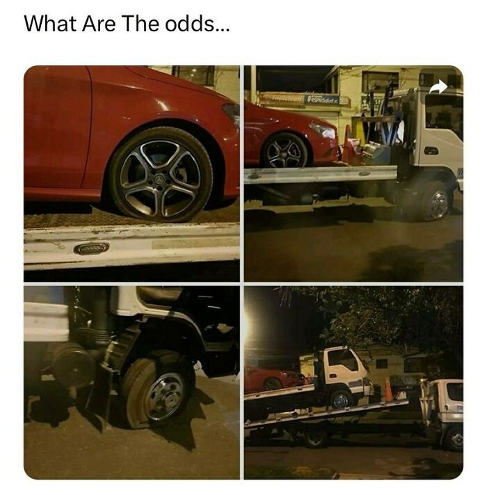 Towing truck with a flat tire ironically carrying a red car in a funny fail scenario at night.