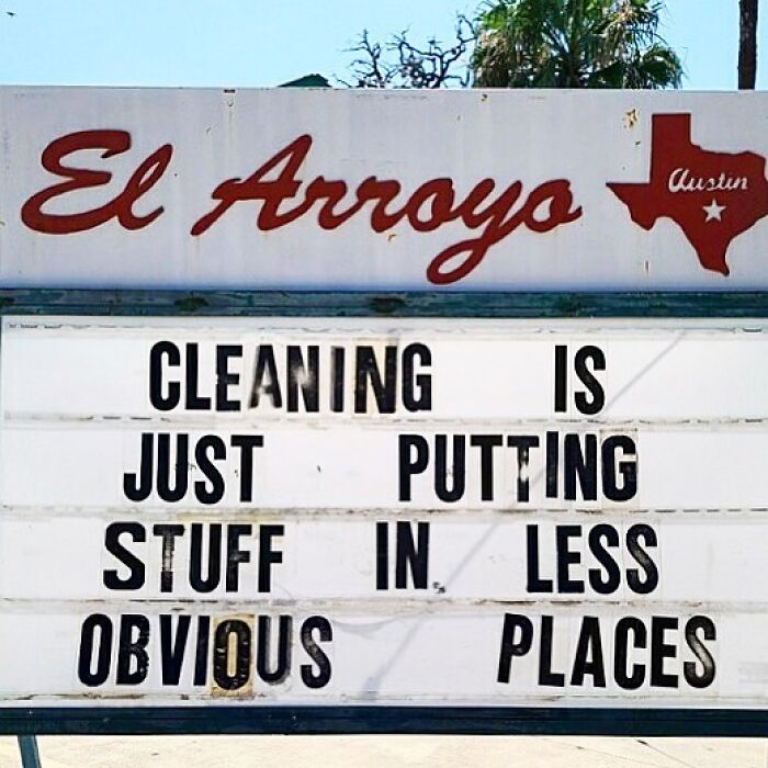 El Arroyo sign with humorous message: "CLEANING IS JUST PUTTING STUFF IN LESS OBVIOUS PLACES."