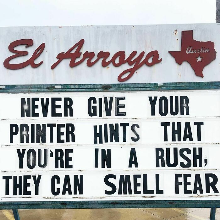 El Arroyo sign stating, "Never give your printer hints you're in a rush; they can smell fear."