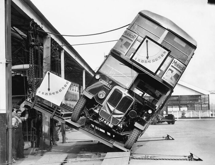 Historical bus test on a tilt platform, illustrating past engineering practices.