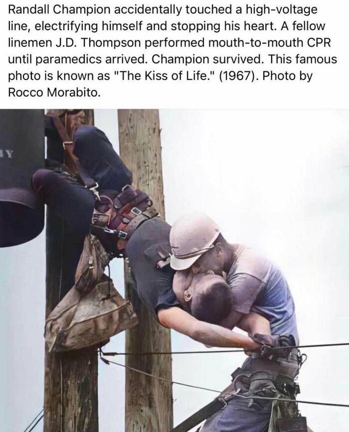 Lineman performing CPR on a colleague on a utility pole; a pivotal moment in history captured by Rocco Morabito.