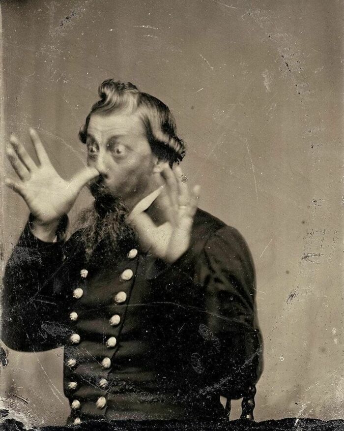 A historical photograph showing a man in military attire making a surprised expression, capturing an interesting history pic.