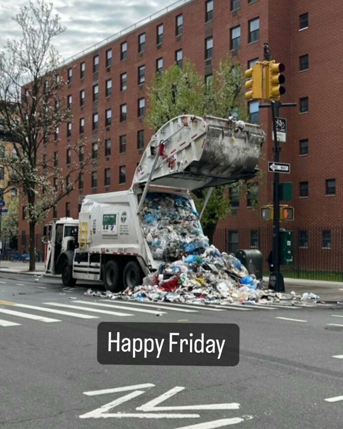 Garbage truck spilling trash onto New York street with "Happy Friday" text overlay.