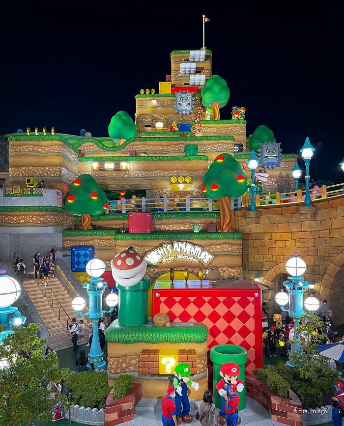 Theme park area resembling classic videogame level with vibrant colors and iconic characters, creating a real-life videogame look.