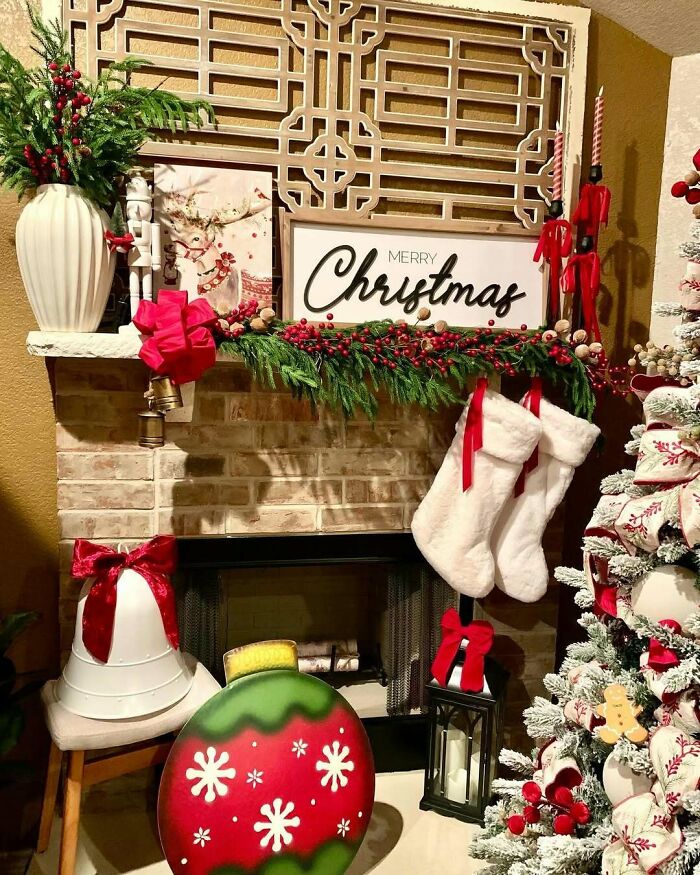 Festive Christmas decorating ideas with stockings, red and green ornaments, and a fireplace adorned with greenery.