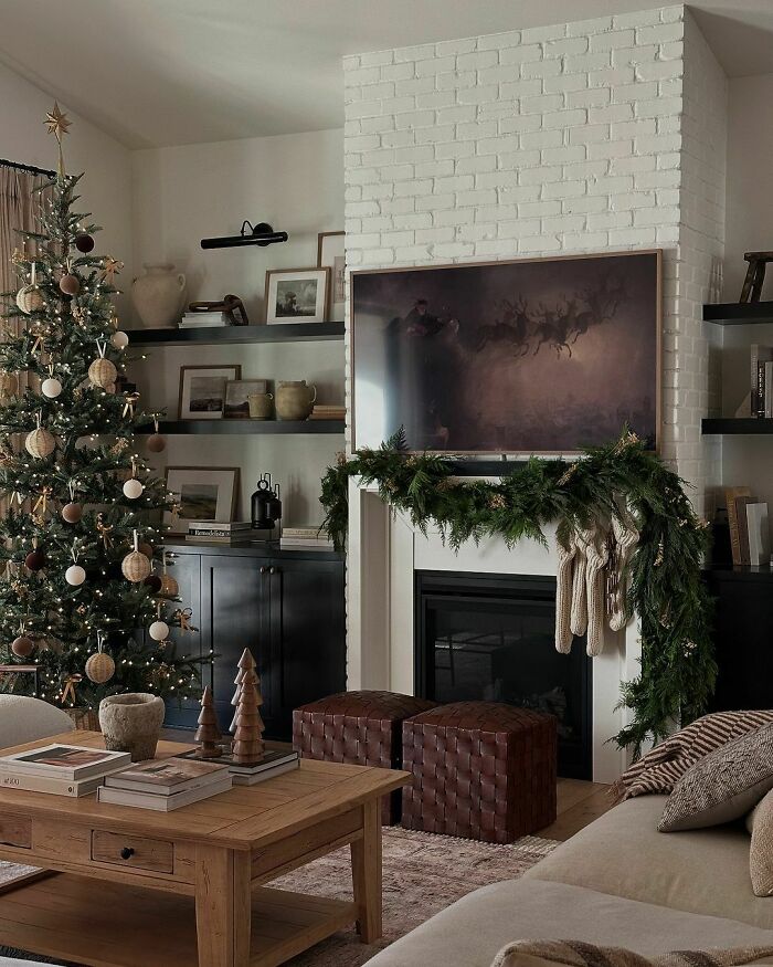 Cozy living room with a decorated Christmas tree and garland, showcasing elegant Christmas-decorating-ideas.