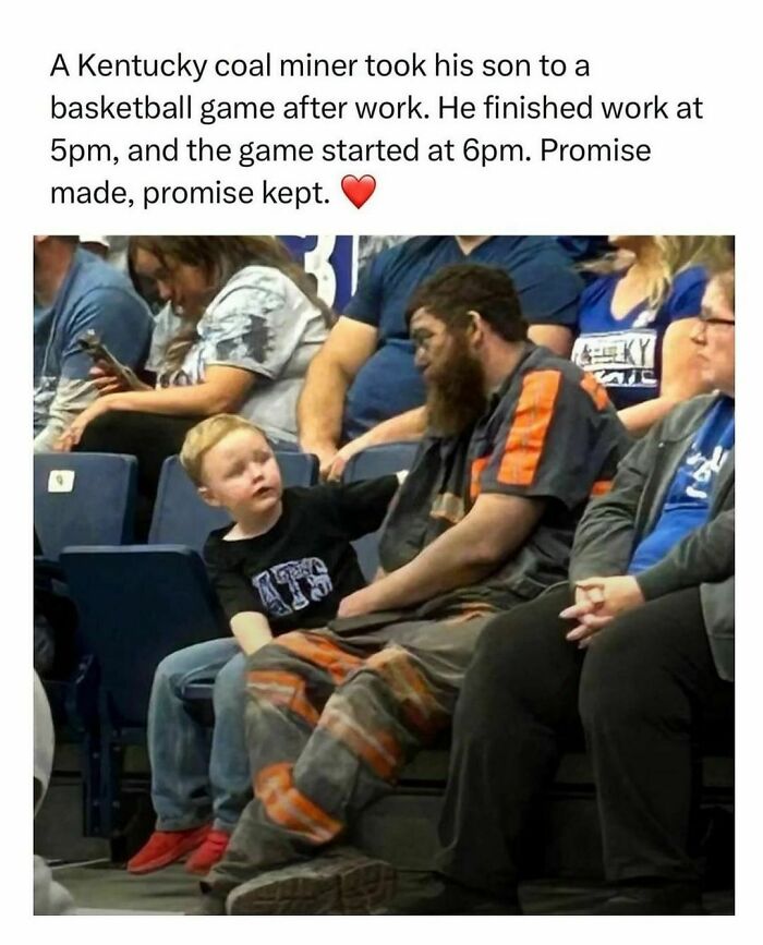 Father and son at a basketball game sharing a moment of wholesome kindness, with the father in work clothes.