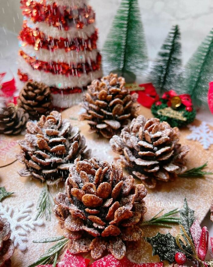 Christmas snack food pine cones with powdered sugar, set against holiday decorations and festive background.