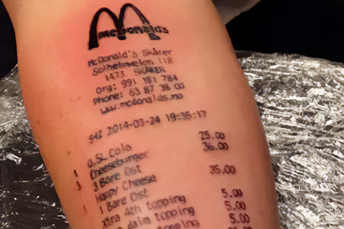 Epic tattoo fail showing a McDonald's receipt tattooed on someone's arm.