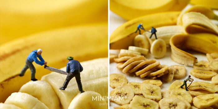 Miniature figures slicing bananas, showcasing the tiny world of foods and things.