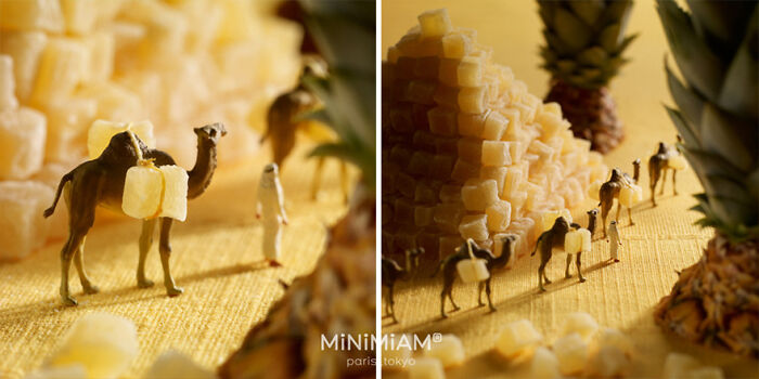 Miniatures of camels and people in a desert made from tiny food cubes, showcasing a creative miniature world.