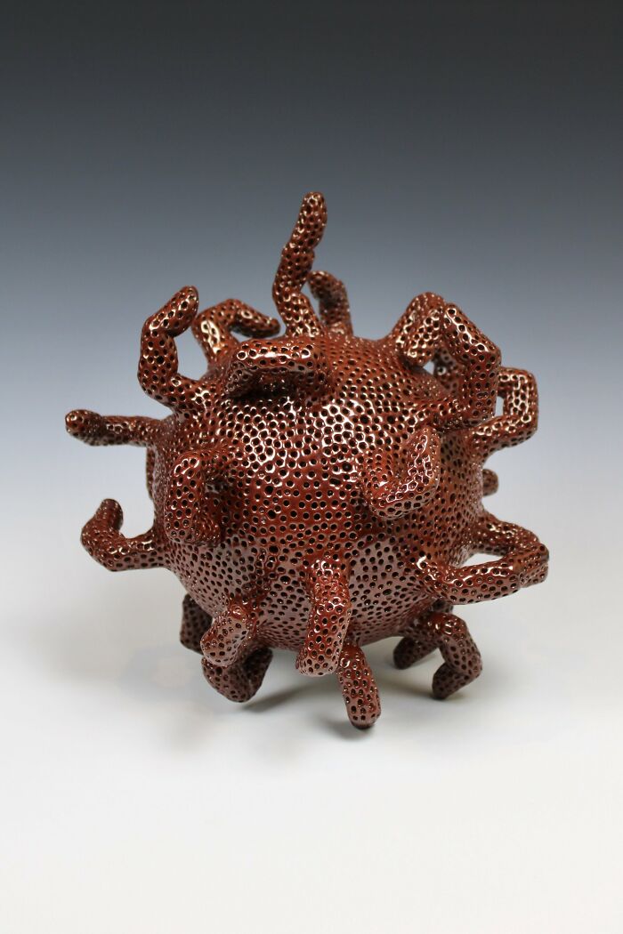 Surreal ceramic art sculpture by Jackson Shaner with intricate, organic shapes and textures in a unique design.