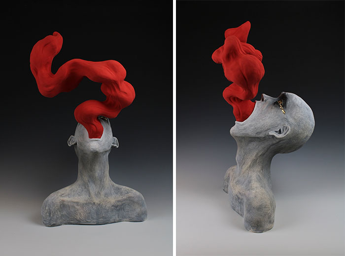 Surreal ceramic art sculpture with red abstract form emerging from a figure's mouth, embodying emotion.