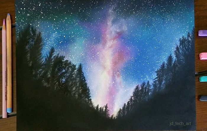 Hyper-realistic pencil drawing of a night sky with stars and colorful nebula above silhouetted trees.