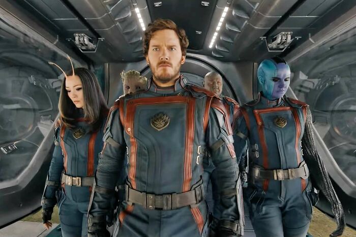 Group of space adventurers walking in a spaceship, featuring characters often discussed in fascinating fan theories.