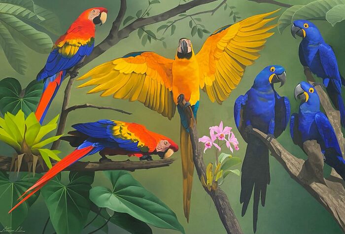 Brazilian artist Petterson Silva's painting of vibrant parrots on branches, featuring colorful feathers in a jungle setting.