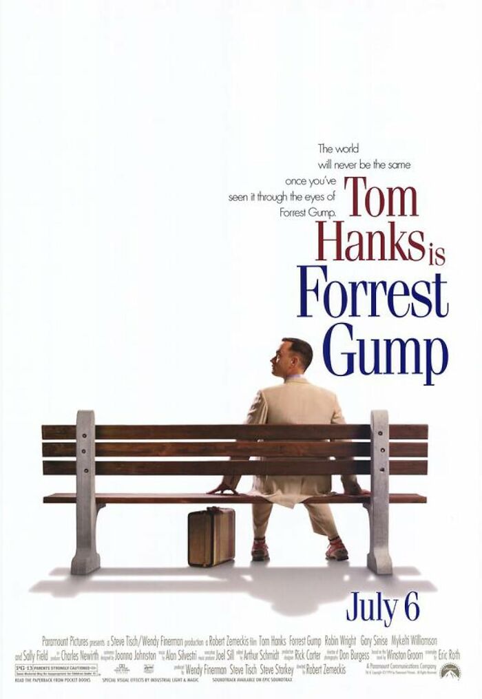 Forrest Gump movie poster featuring Tom Hanks sitting on a bench with a suitcase.