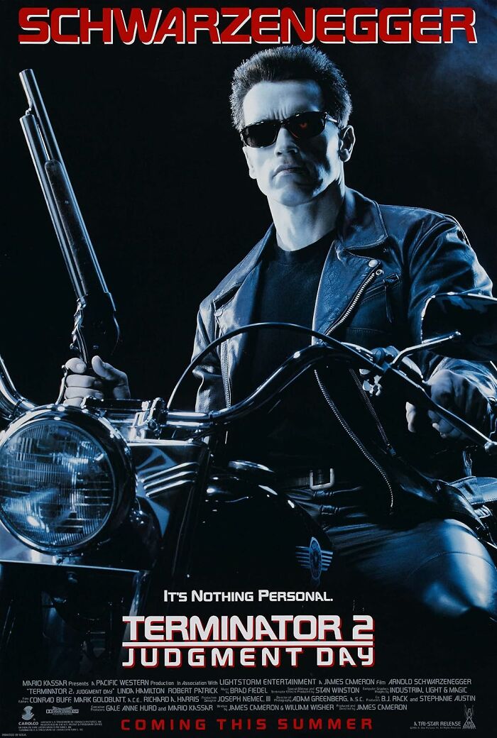 Terminator 2 movie poster showing Schwarzenegger on a motorcycle with sunglasses and a gun.