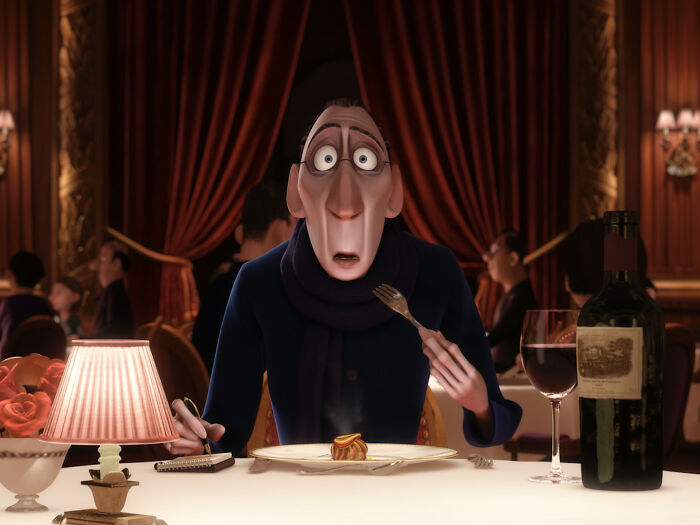 Critic sits wide-eyed at a table, fork in hand, pondering a dish, embodying fascinating fan theories in an animated setting.