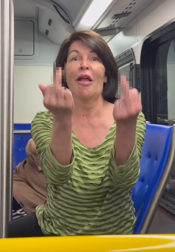 Passenger on a bus expressing anger.