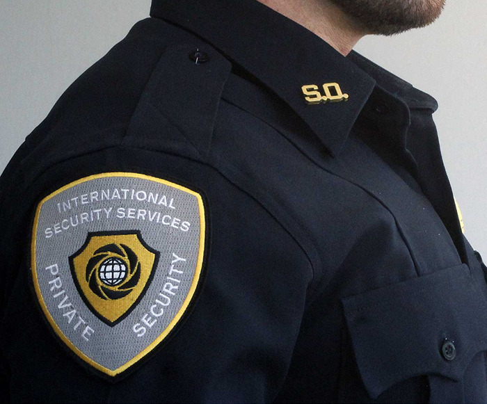 Security expert in uniform with "International Private Security Services" patch.