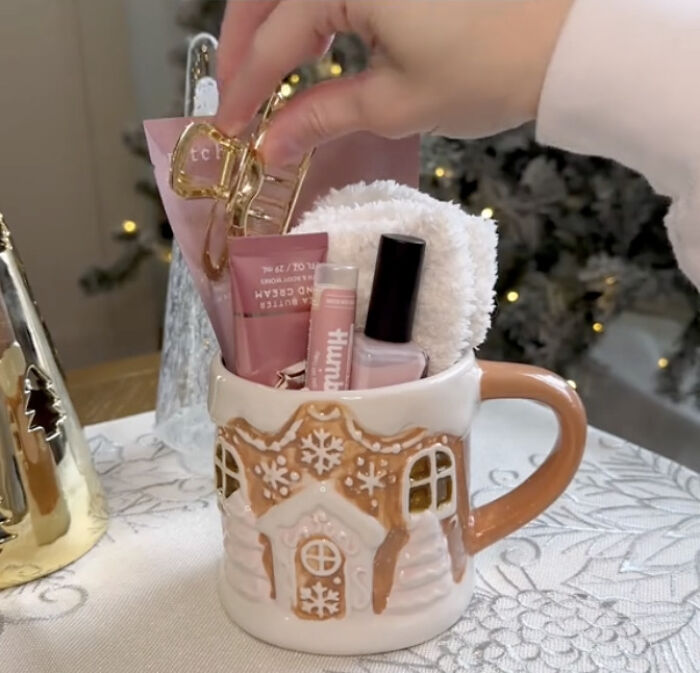 Festive mugs on a snowy background, a creative way to gift a gift card during the holidays.