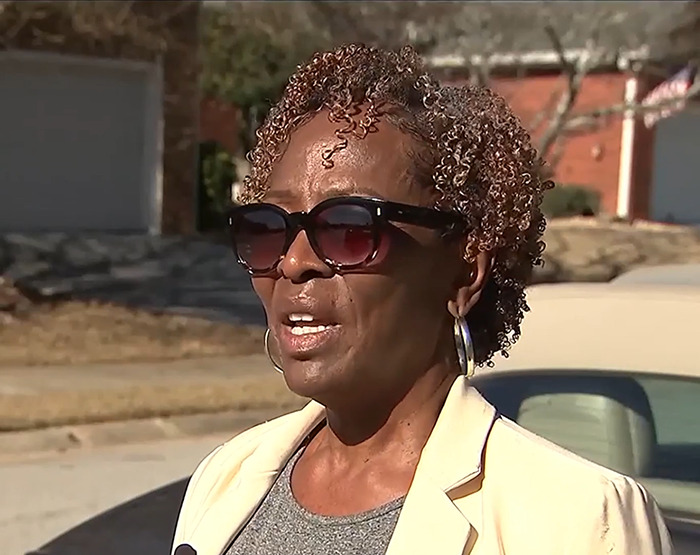 Loletha Hale wearing sunglasses outside, related to squatter home reclaiming incident.