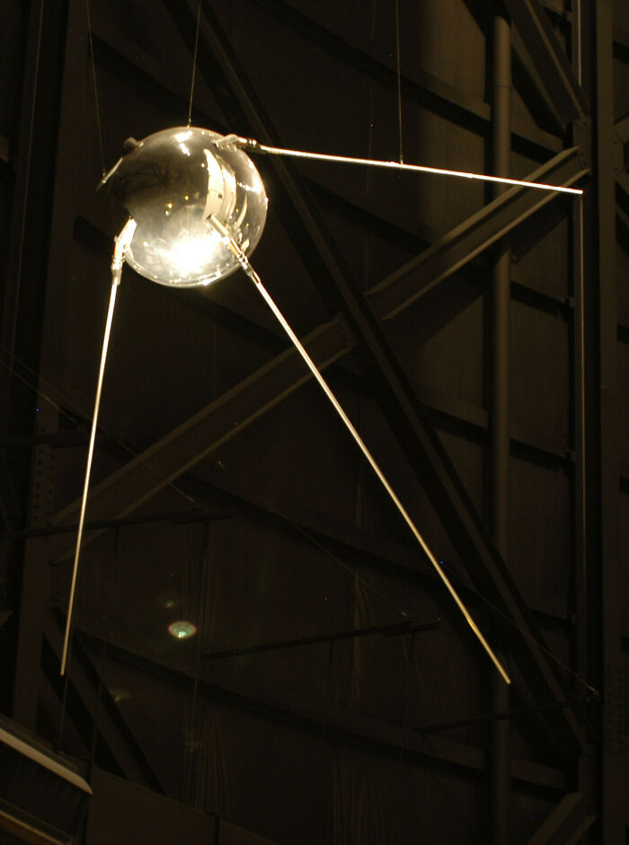 Historic Sputnik satellite suspended, showcasing a pivotal moment in space history innovation.