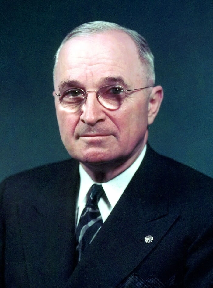 Harry S. Truman posing for a photo