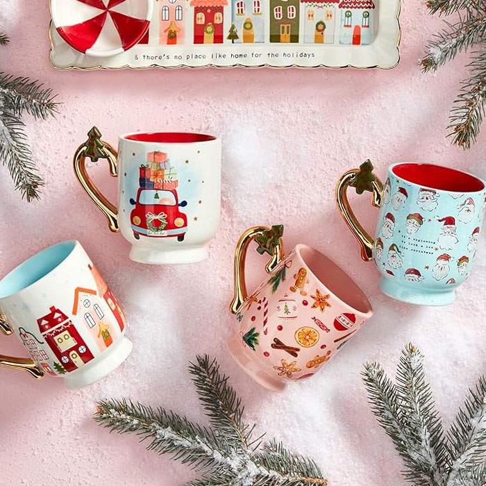 Festive mugs on a snowy background, a creative way to gift a gift card during the holidays.